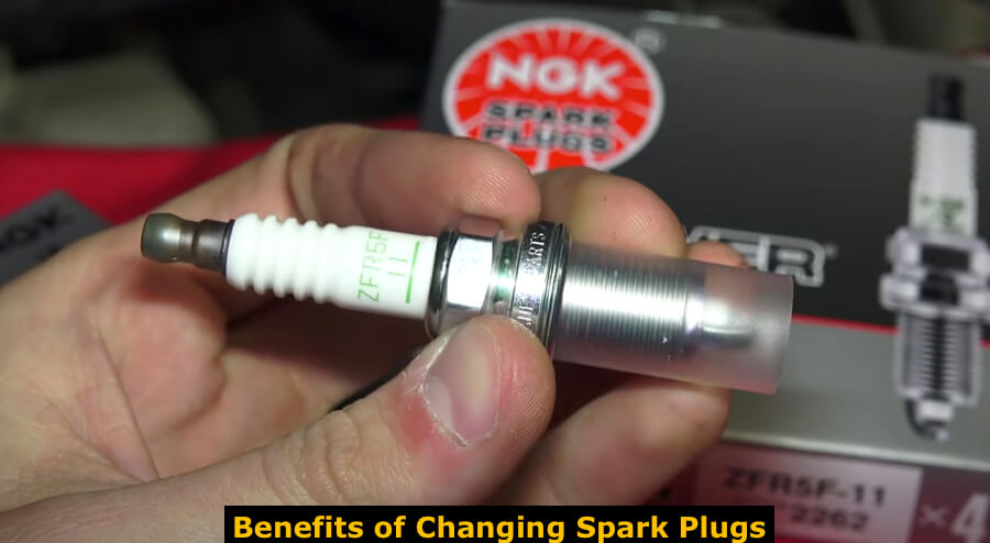 Replacing an old spark plug for a vehicle.